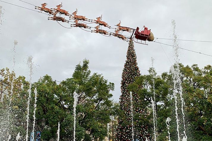 Santa Claus in his sleigh with his reindeer