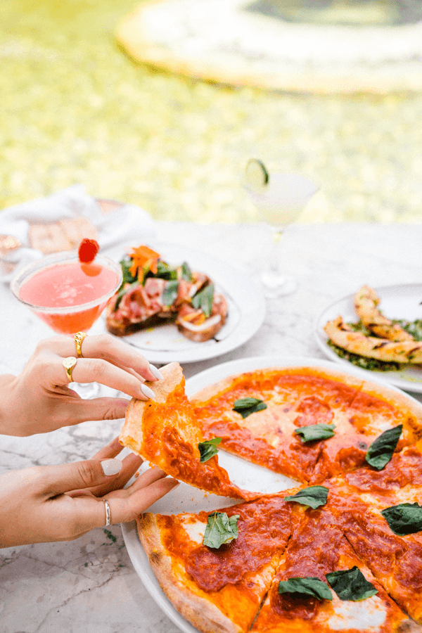 Delicious pizza with cocktail